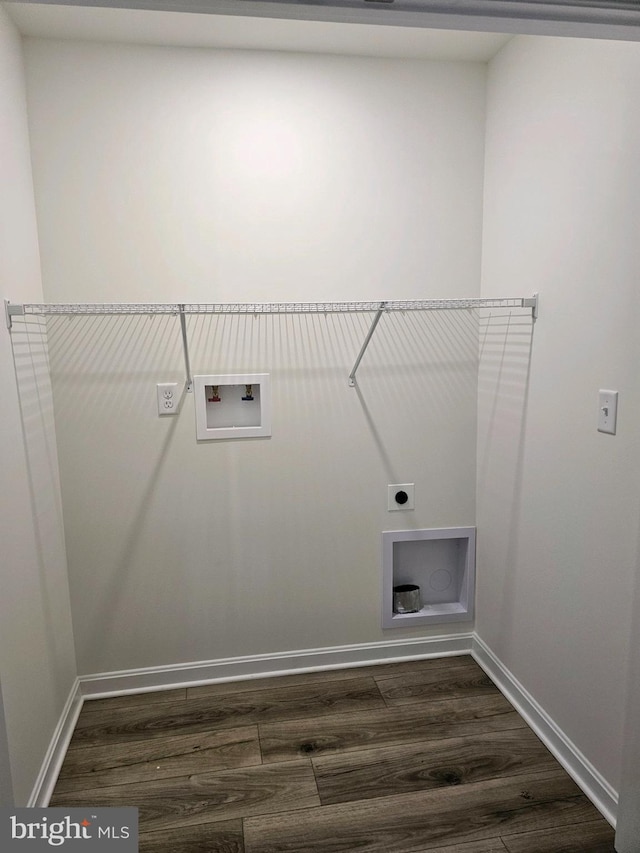 clothes washing area with hookup for an electric dryer, dark wood-type flooring, and hookup for a washing machine