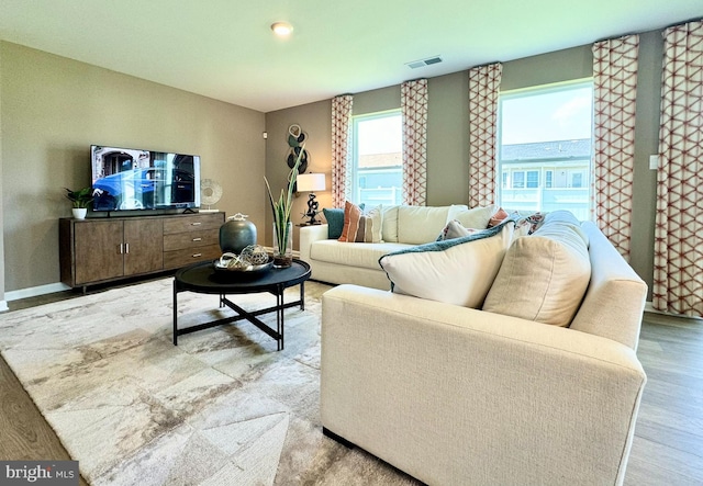 living room with light hardwood / wood-style floors