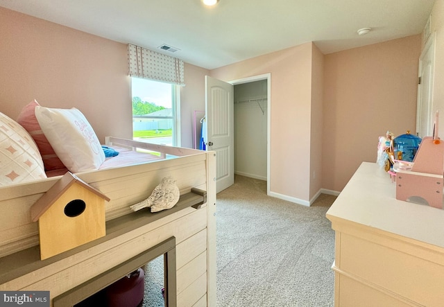 carpeted bedroom with a closet