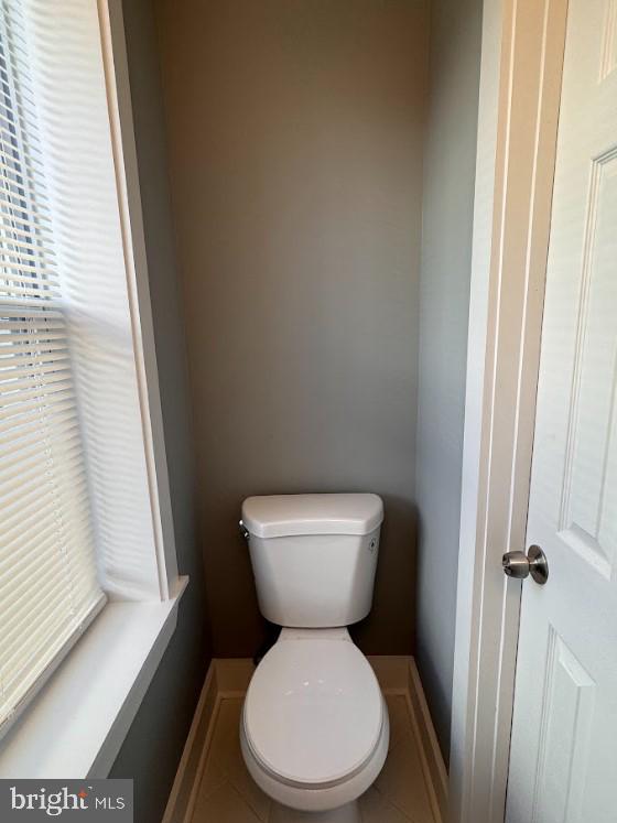 bathroom featuring tile patterned floors and toilet