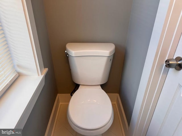 bathroom featuring tile patterned floors and toilet