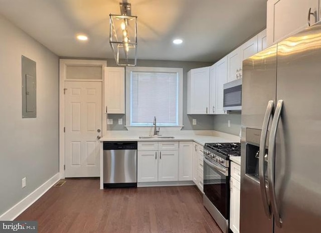 725 N Streeper St, Baltimore, MD 21205 - kitchen with stainless steel appliances, electric panel, light countertops, dark wood-type flooring, and white cabinets
