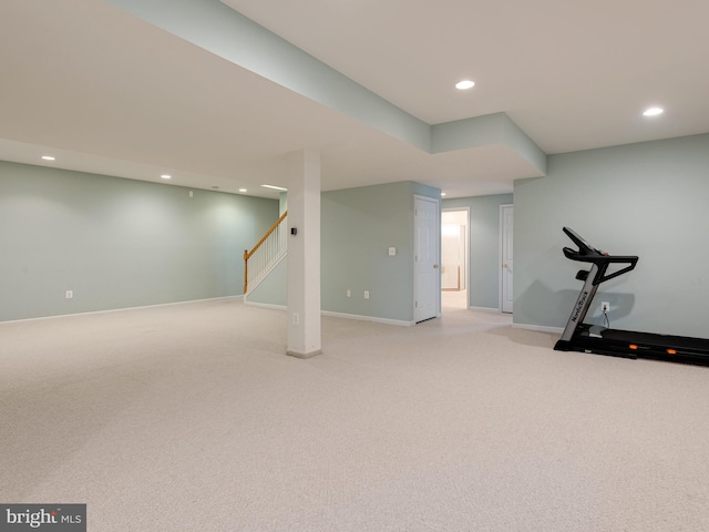 workout area featuring light colored carpet