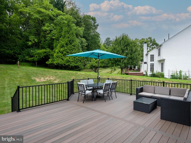 wooden terrace with a yard and an outdoor living space