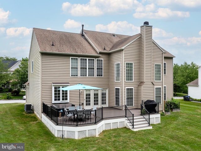 back of house with a lawn, central AC unit, and a wooden deck