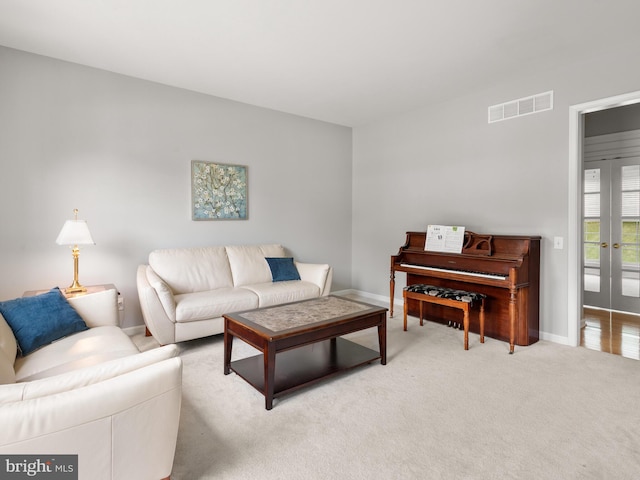 living room featuring light carpet