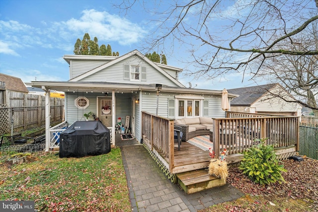 rear view of house with a deck