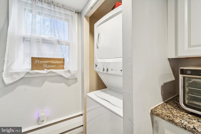 laundry room featuring stacked washer and clothes dryer