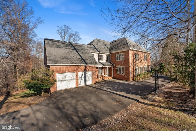 view of side of property with a garage