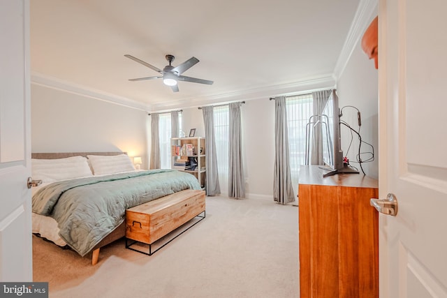 bedroom with carpet flooring, ceiling fan, and crown molding