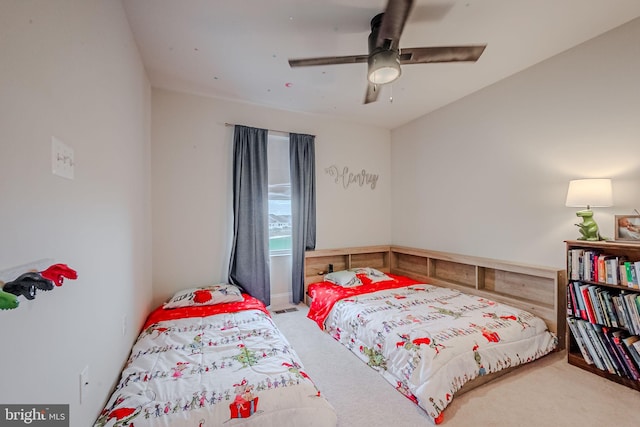 bedroom featuring ceiling fan and carpet floors