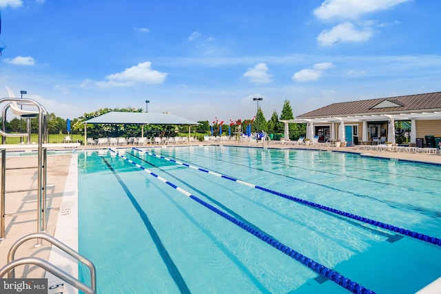 view of pool featuring a patio