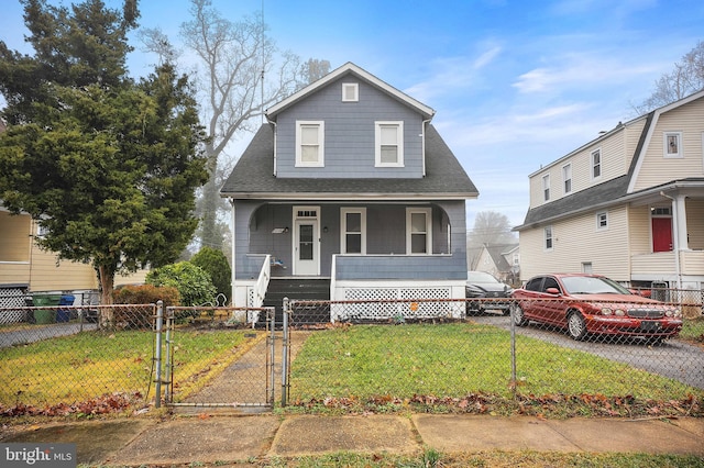 view of front of home featuring covered porch and a front lawn