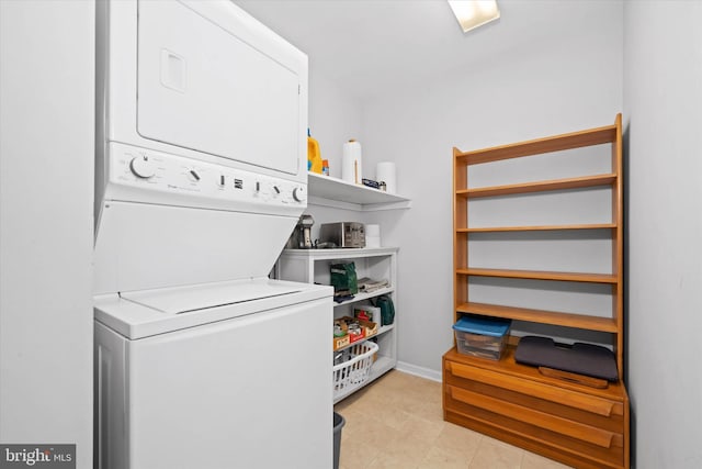 laundry room featuring stacked washer and dryer