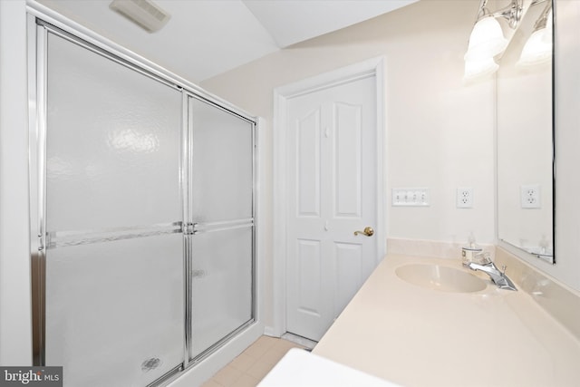 bathroom featuring an enclosed shower, vanity, and tile patterned floors