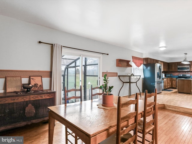 dining space featuring light hardwood / wood-style flooring