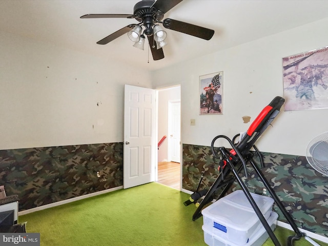 workout room featuring carpet flooring and ceiling fan