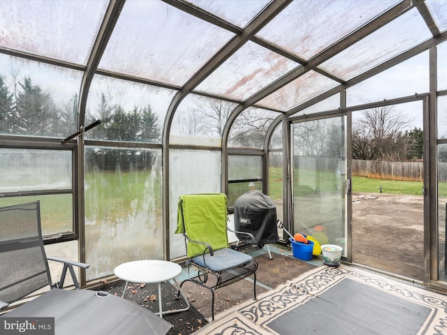 sunroom / solarium with lofted ceiling