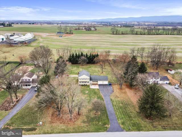 birds eye view of property with a mountain view and a rural view