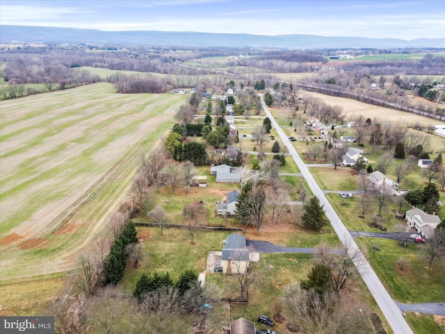 birds eye view of property featuring a mountain view and a rural view