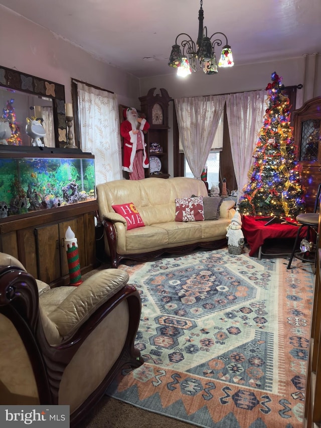 living room featuring carpet floors and an inviting chandelier