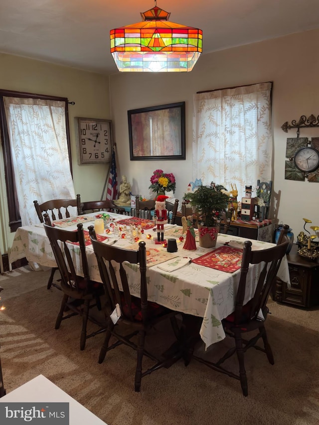 view of carpeted dining space