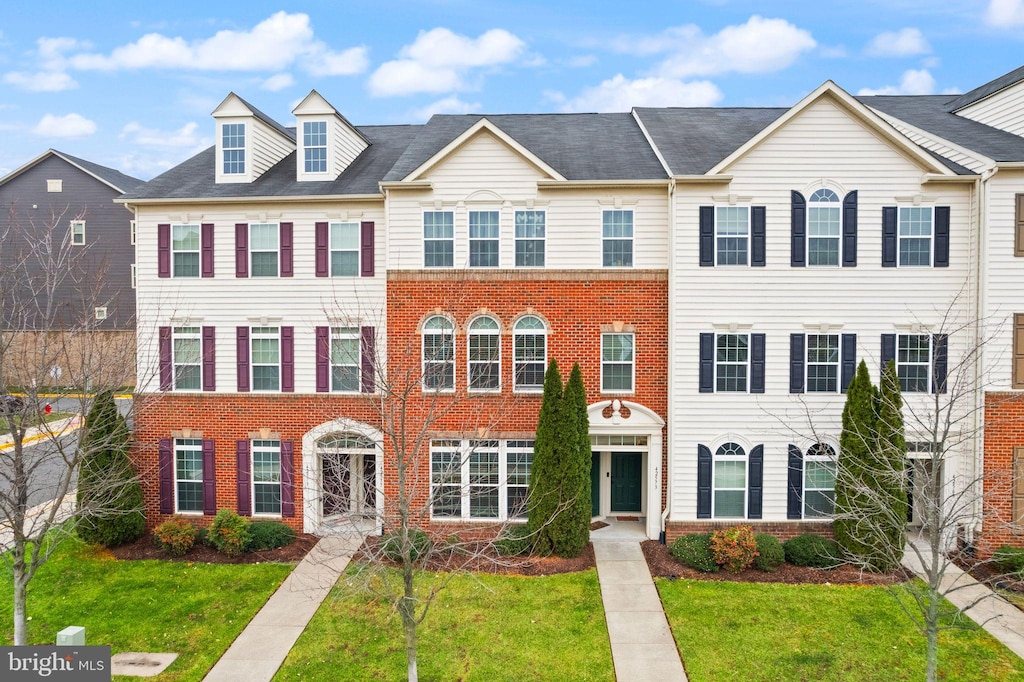 view of property with a front lawn