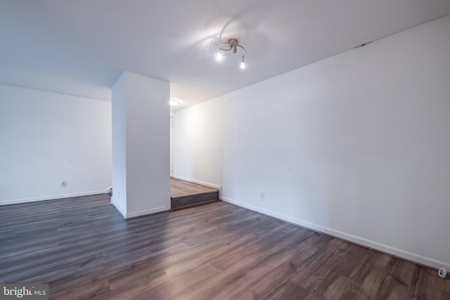 basement featuring dark hardwood / wood-style floors