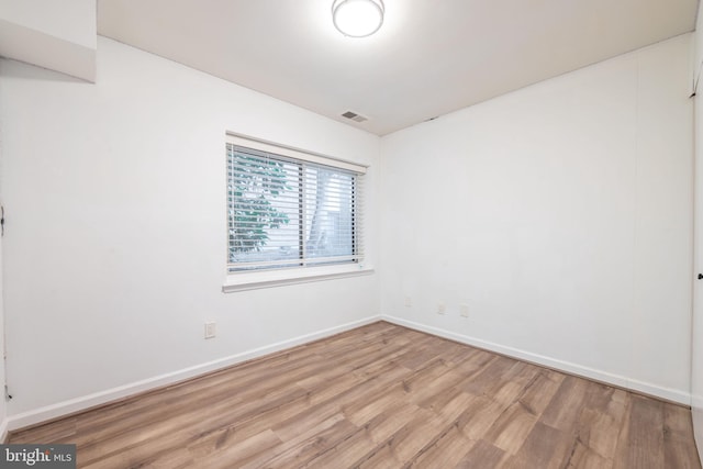 spare room with light hardwood / wood-style floors