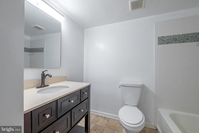 full bathroom with vanity, tiled shower / bath combo, and toilet