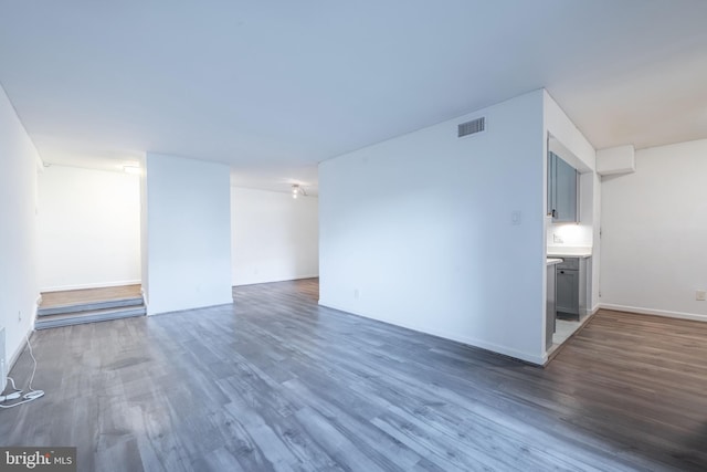 empty room featuring dark hardwood / wood-style flooring