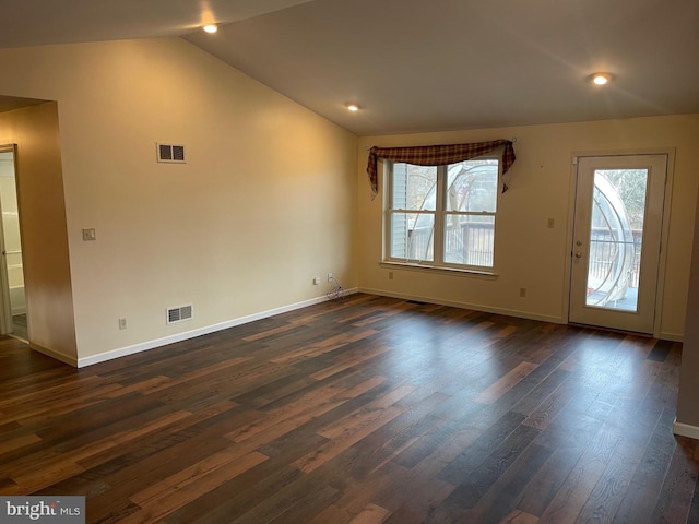 interior space with lofted ceiling and dark hardwood / wood-style flooring