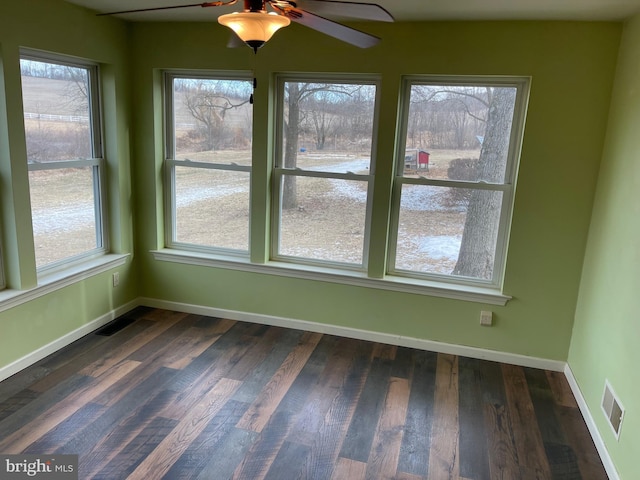 interior space with ceiling fan