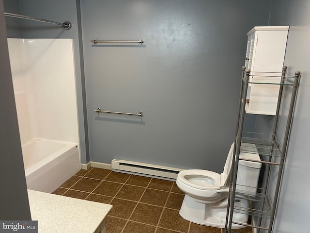 bathroom featuring baseboard heating, tile patterned flooring, and toilet