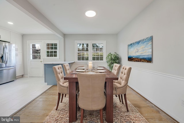 dining space featuring light wood-type flooring