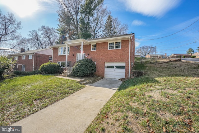 view of front of property with a front yard and a garage