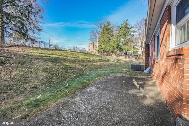 view of yard featuring a patio area and cooling unit