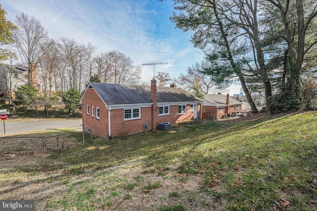 view of property exterior featuring a yard and cooling unit