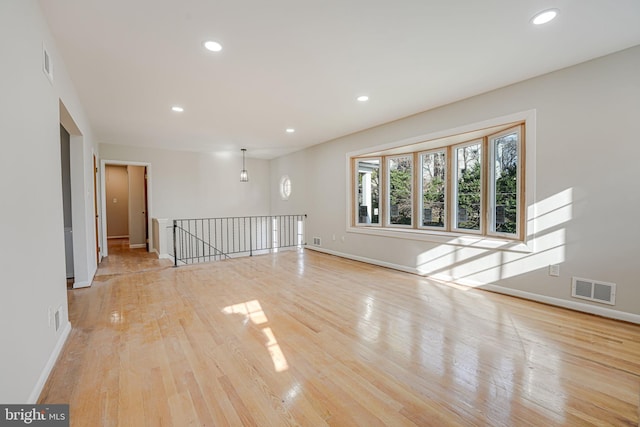 unfurnished room featuring light wood-type flooring