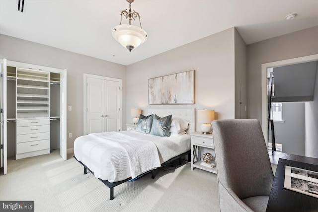 bedroom with light colored carpet