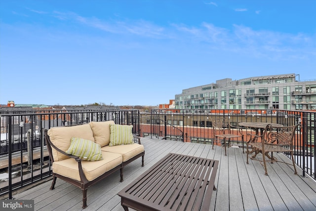 wooden deck featuring an outdoor hangout area