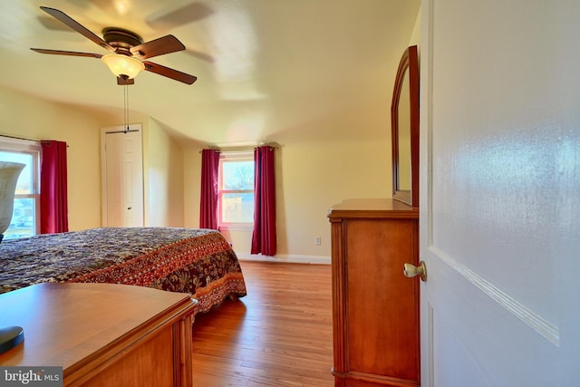 bedroom with ceiling fan and light wood-type flooring