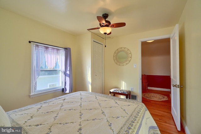 bedroom featuring hardwood / wood-style floors and ceiling fan