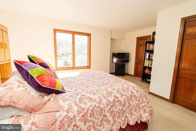 bedroom with light carpet