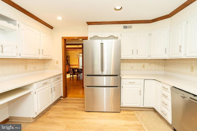 kitchen featuring white cabinets, stainless steel appliances, and light wood-type flooring