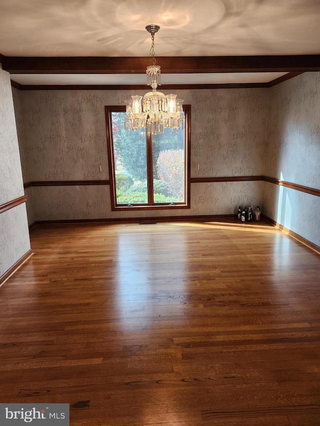 interior space with beamed ceiling, a notable chandelier, and wood-type flooring