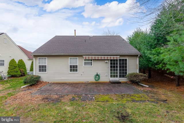 rear view of property featuring a patio area