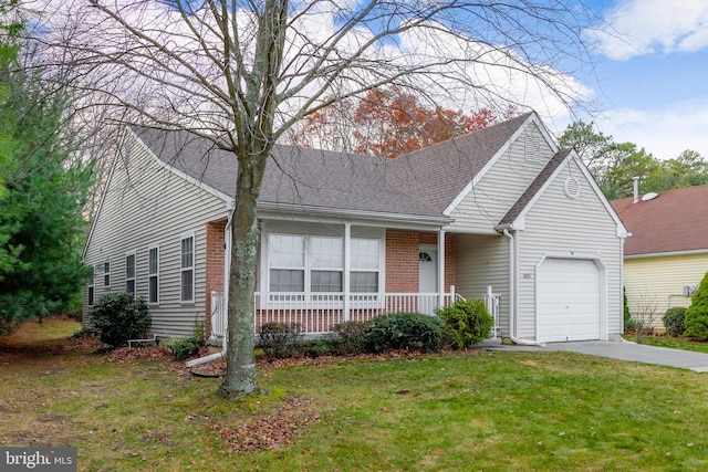 view of front of home with a garage and a front lawn