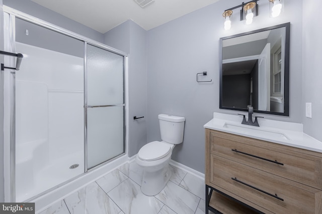 bathroom with vanity, toilet, and an enclosed shower