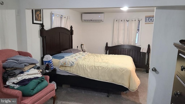 bedroom featuring a wall unit AC and carpet floors